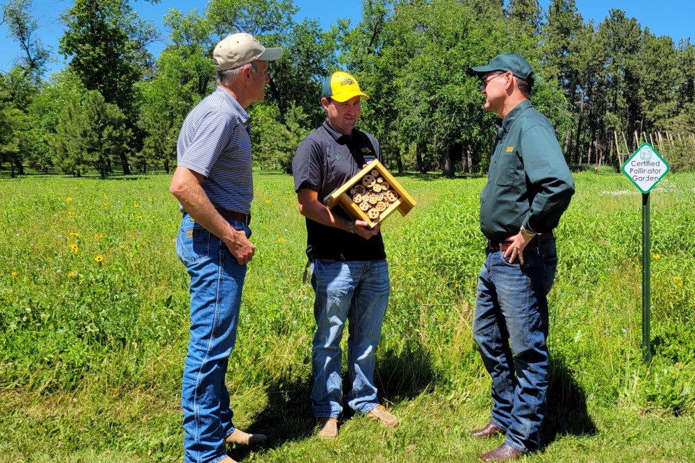 At the Dickinson Research Extension Center, President Cook learned more about bees and the critical role of pollinators.