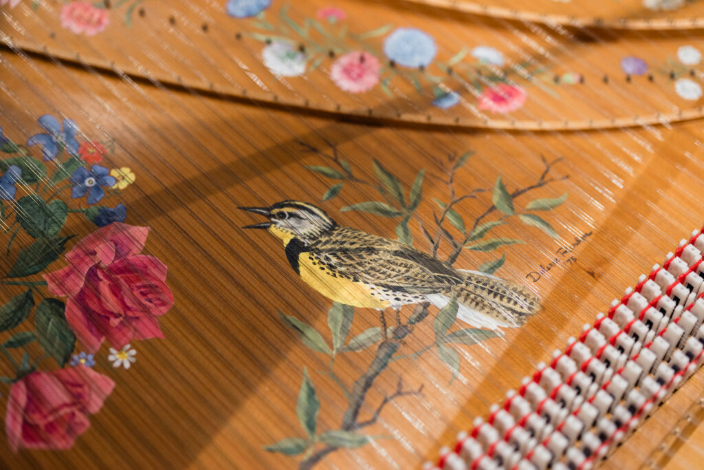 Close-up of the art painted on the soundboard of the Harpsichord.