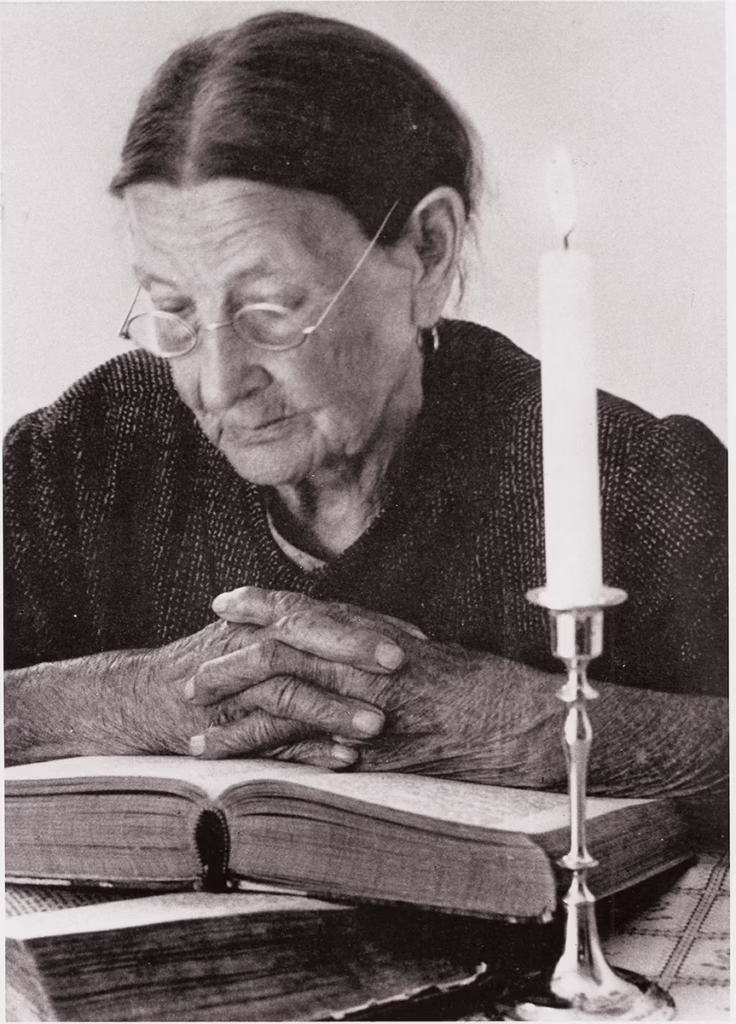 A German woman reading in a church.