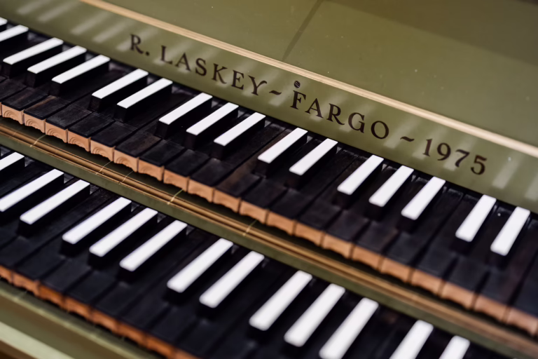 Close-up of decorative details and craftsmanship on the Hubbard Harpsichord at NDSU.